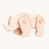 A Tobe wooden rhinoceros figure toy with movable legs. We have a range of Tobe animal figures available at Babipur. 