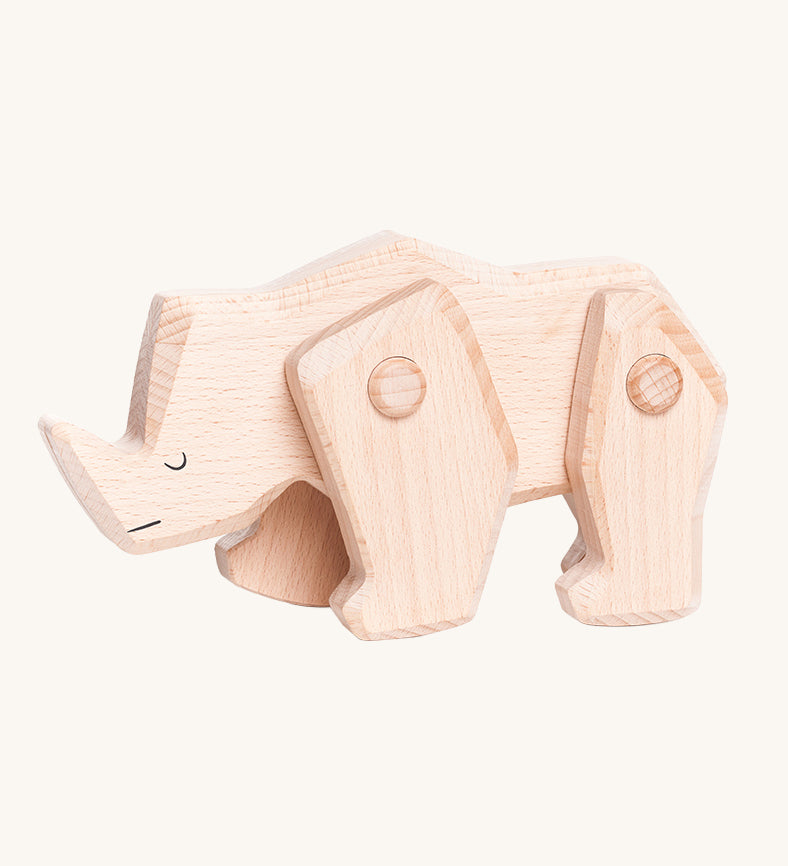 A Tobe wooden rhinoceros figure toy with movable legs. We have a range of Tobe animal figures available at Babipur. 