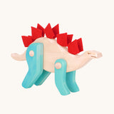 Tobe Extinct Animals Stegosaurus. A natural wooden body with blue coloured legs and red felt details along the back. These heirloom quality toys by Tobe Bajo are part of a wide range of wooden toys available here at Babipur. 
