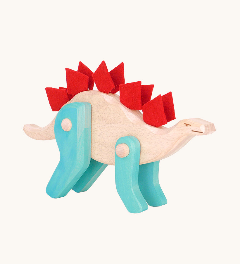 Tobe Extinct Animals Stegosaurus. A natural wooden body with blue coloured legs and red felt details along the back. These heirloom quality toys by Tobe Bajo are part of a wide range of wooden toys available here at Babipur. 