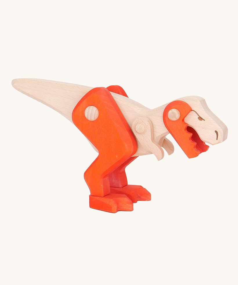 Tobe Extinct Animals T-Rex. A natural wooden dinosaur figure with orange coloured legs and lower jaw. These heirloom quality toys by Bajo are part of a wide range of wooden toys available here at Babipur. 
