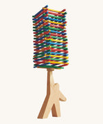 Bajo Athlete wooden stacking and balance game. A wooden toy figure used as a base to stack colourful slim wooden batons.