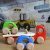 A red coloured Bajo auto transporter. These heirloom quality toys by Bajo are part of a wide range of wooden toys available here at Babipur. 