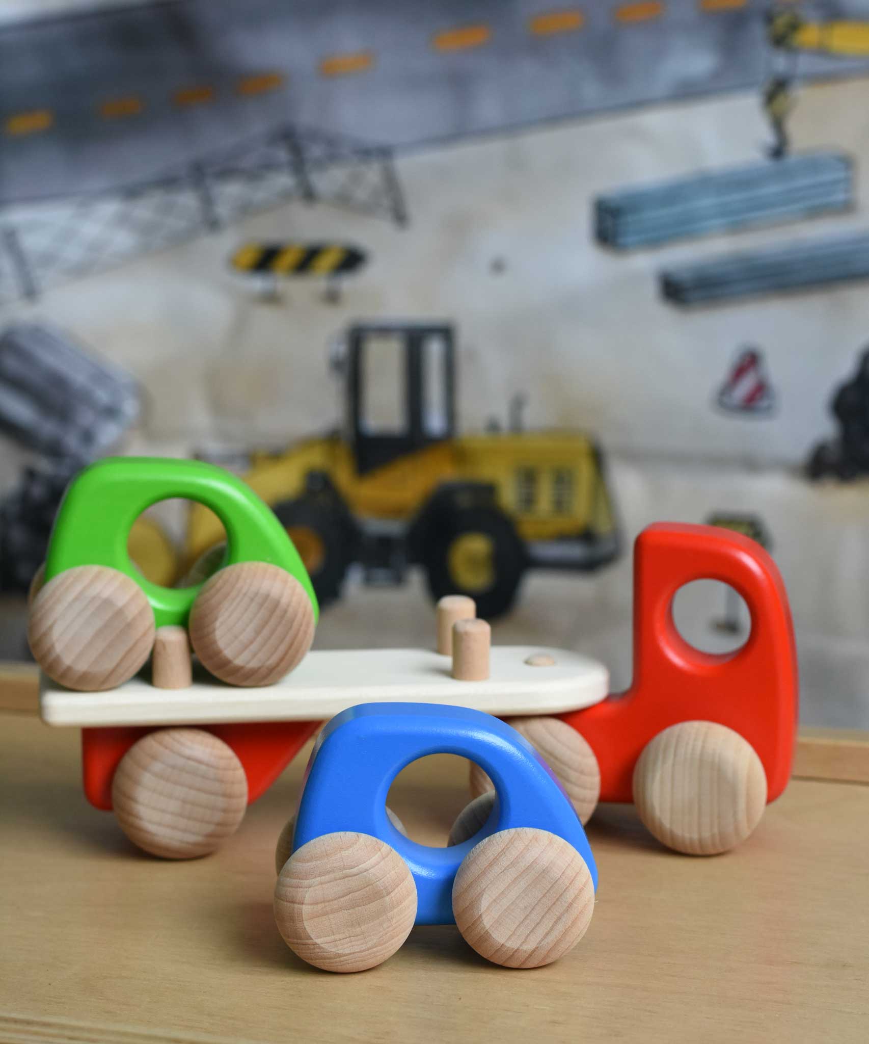 A red coloured Bajo auto transporter. These heirloom quality toys by Bajo are part of a wide range of wooden toys available here at Babipur. 