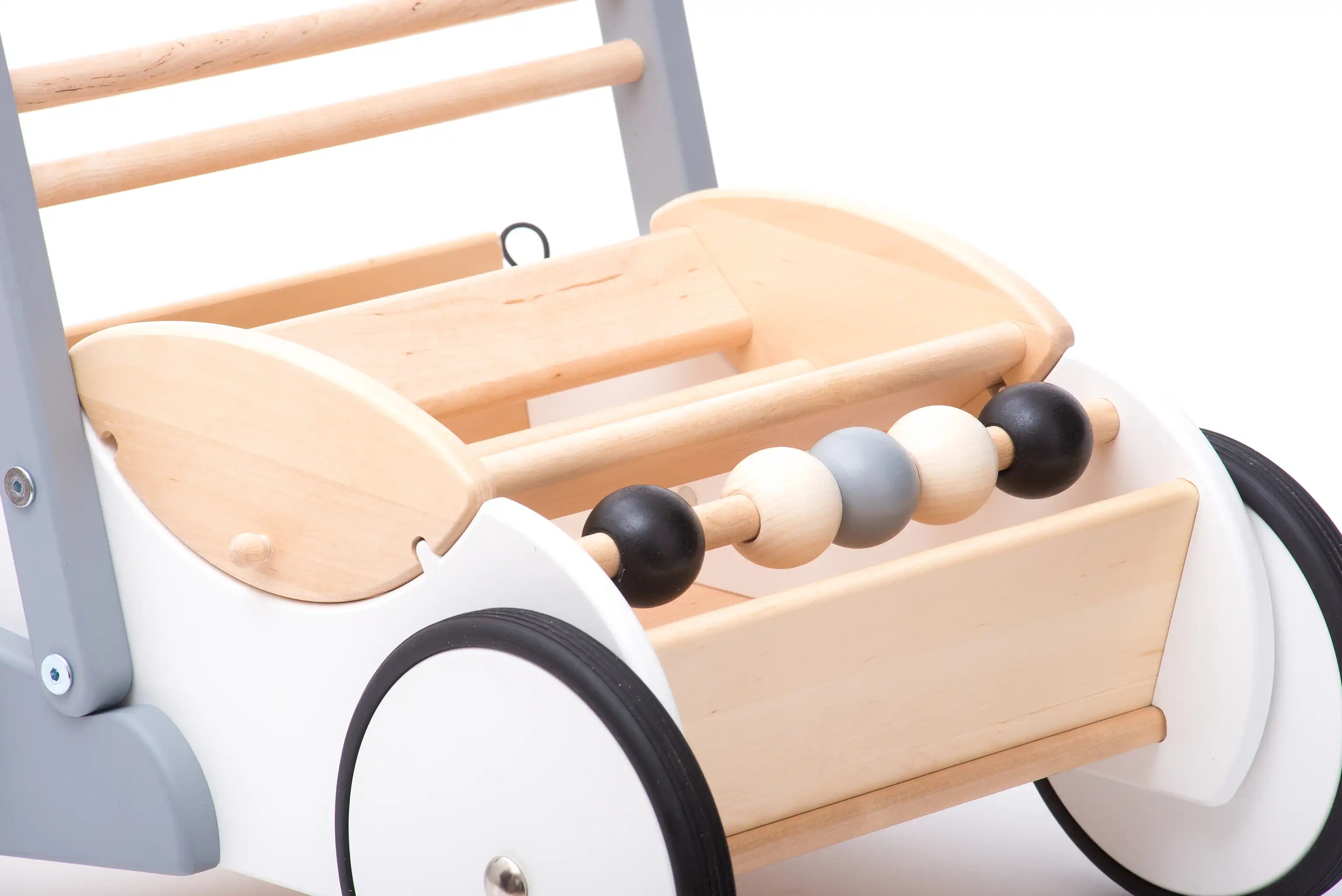 Close up of the monochrome 5 wooden ball abacus on the front of the Bajo monochrome baby walker.