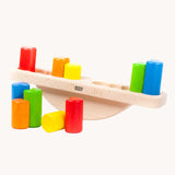 Bajo Balance Scale wooden toy. A wooden base with a curved base with coloured wooden blocks that sit on top. These heirloom quality toys by Bajo are part of a wide range of wooden toys available here at Babipur.