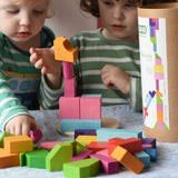 Bajo 43 wooden building blocks. 43 blocks, in 16 different shapes and 10 colours. Children stacking blocks.