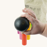 A close up of one of the balls included in the Bajo Fellow Skittles wooden toy game. These heirloom quality toys by Bajo are part of a wide range of wooden toys available here at Babipur.