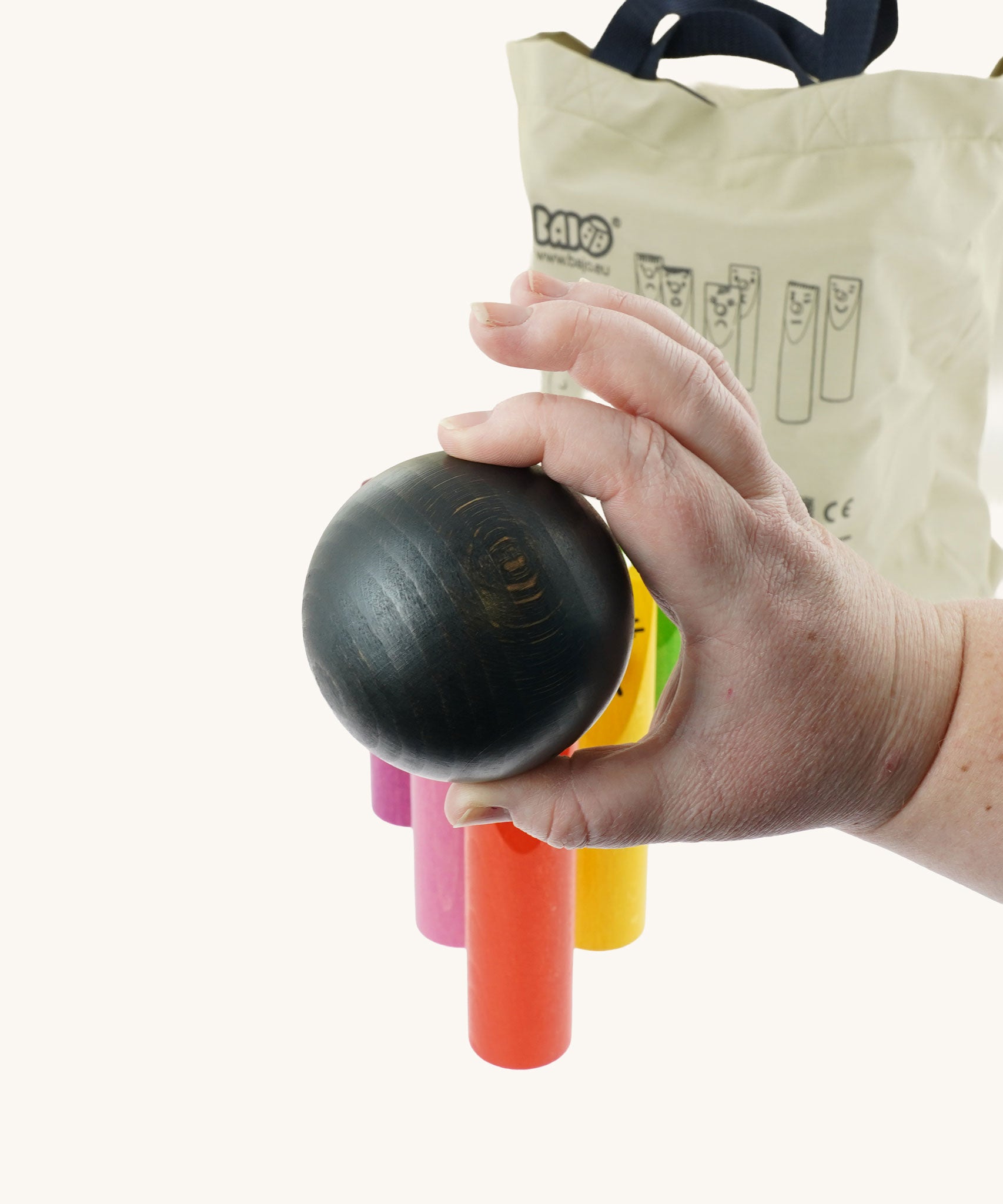 A close up of one of the balls included in the Bajo Fellow Skittles wooden toy game. These heirloom quality toys by Bajo are part of a wide range of wooden toys available here at Babipur.