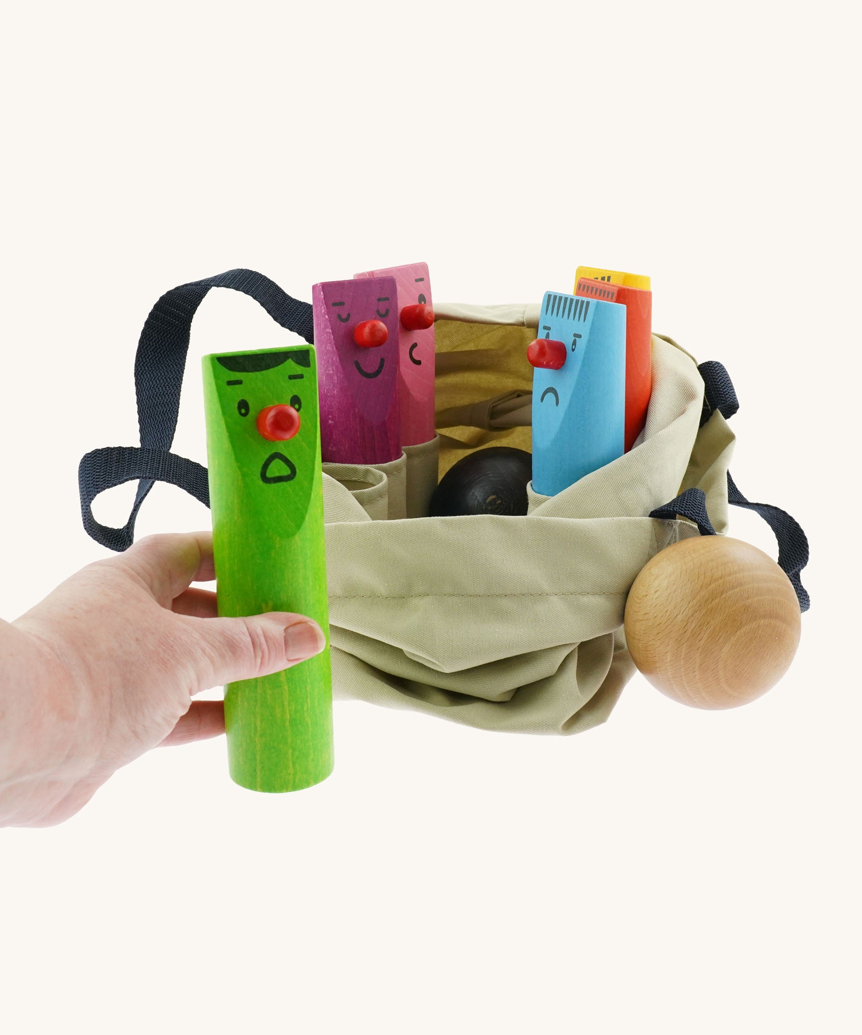 Bajo Fellow Skittles wooden toy game. Six coloured wooden skittles decorated with faces with red noses. The set comes with two wooden balls.  These heirloom quality toys by Bajo are part of a wide range of wooden toys available here at Babipur.