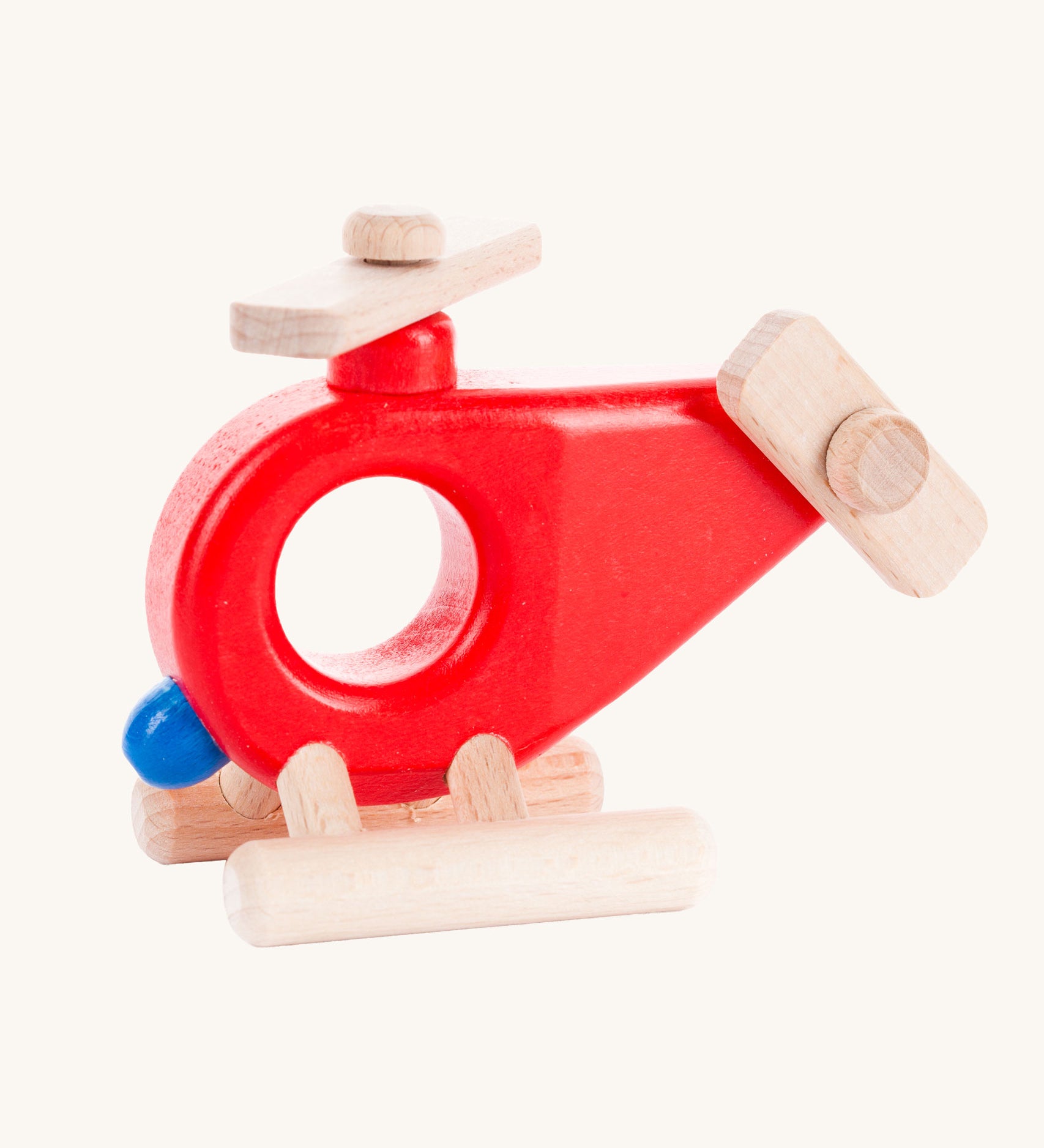 Bajo Red Fire Engine Helicopter wooden toy. The red coloured wooden helicopter has natural propellers and stand and a blue lamp details on the front. These heirloom quality toys by Bajo are part of a wide range of wooden toys available here at Babipur. 