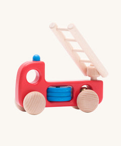 Bajo Fire Engine wooden toy vehicle. A red body truck with blue details on the body and roof with a natural wooden ladder and wheels.