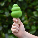Large green bobble tree from the Bajo green forest tree set in a child's hand.