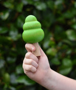 Large green bobble tree from the Bajo green forest tree set in a child's hand.