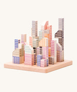 Bajo Manhattan city Blocks wooden toy blocks on a wooden base.