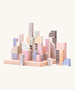 Bajo Manhattan city Blocks wooden toy blocks on a wooden base.