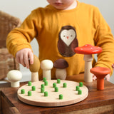 A child playing with the Bajo Wooden Mushroom Forest Peg Puzzle. The child is picking up the yellow coloured mushroom. These heirloom quality toys by Bajo are part of a wide range of wooden toys available here at Babipur. 