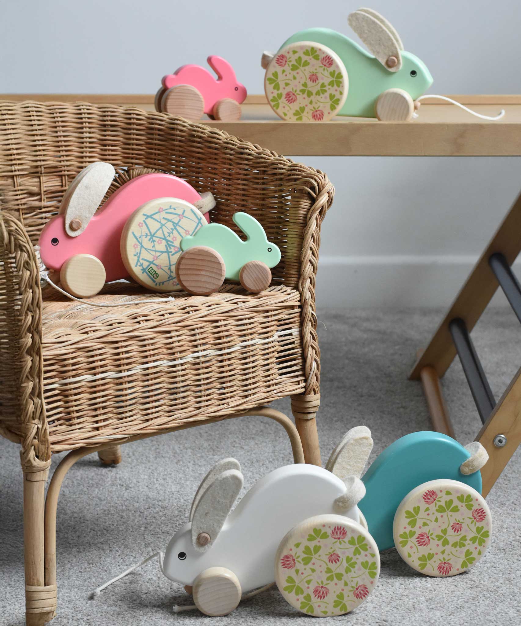 The Bajo big and small rabbits shown on and next to a chil'ds chair and Miri slide. These heirloom quality toys by Bajo are part of a wide range of wooden toys available here at Babipur.