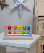 Bajo Sparrow Abacus wooden toy. This abacus has 5 little birds and 5 round counters. These heirloom quality toys by Bajo are part of a wide range of wooden toys available here at Babipur.