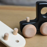 A close up of the trailer attachment hitch on the black Bajo Auto Transporter with the trailer detached. These heirloom quality toys by Bajo are part of a wide range of wooden toys available here at Babipur. 