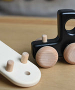A close up of the trailer attachment hitch on the black Bajo Auto Transporter with the trailer detached. These heirloom quality toys by Bajo are part of a wide range of wooden toys available here at Babipur. 