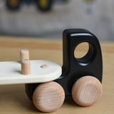 A close up of the trailer attachment hitch on the black Bajo Auto Transporter with the trailer attached. These heirloom quality toys by Bajo are part of a wide range of wooden toys available here at Babipur. 