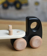 A close up of the trailer attachment hitch on the black Bajo Auto Transporter with the trailer attached. These heirloom quality toys by Bajo are part of a wide range of wooden toys available here at Babipur. 