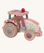 A wooden toy tractor built from the Bajo DIY Tractor kit. The tractor has been decorated with colourful patterns all over. These heirloom quality toys by Bajo are part of a wide range of wooden toys available here at Babipur. 