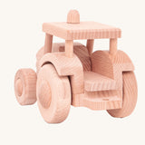 The back of a wooden toy tractor built from the Bajo DIY Tractor kit. These heirloom quality toys by Bajo are part of a wide range of wooden toys available here at Babipur. 