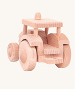 The back of a wooden toy tractor built from the Bajo DIY Tractor kit. These heirloom quality toys by Bajo are part of a wide range of wooden toys available here at Babipur. 