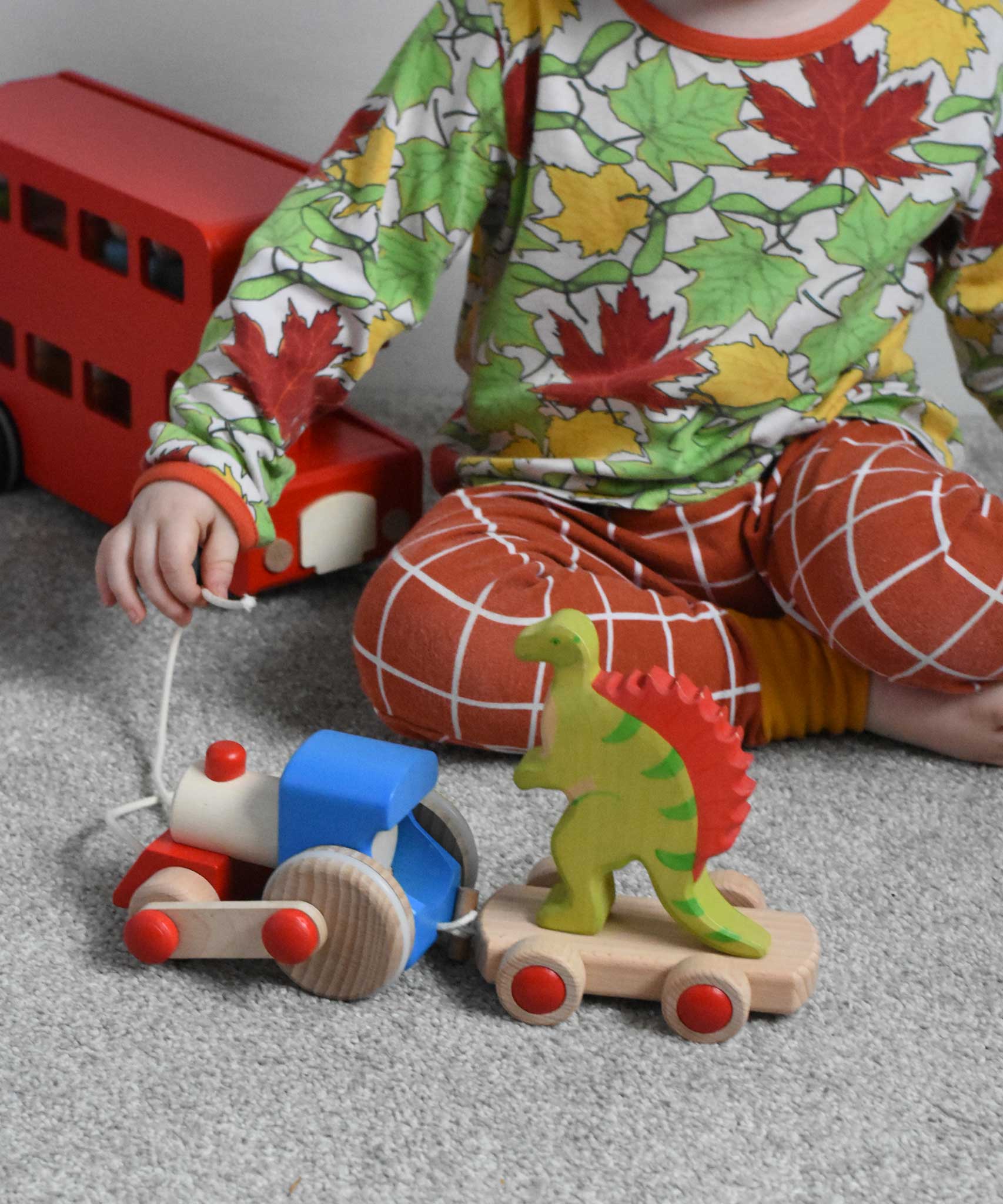A child playing with the Bajo choo-choo train wooden pull-along toy. These heirloom quality toys by Bajo are part of a wide range of wooden toys available here at Babipur.