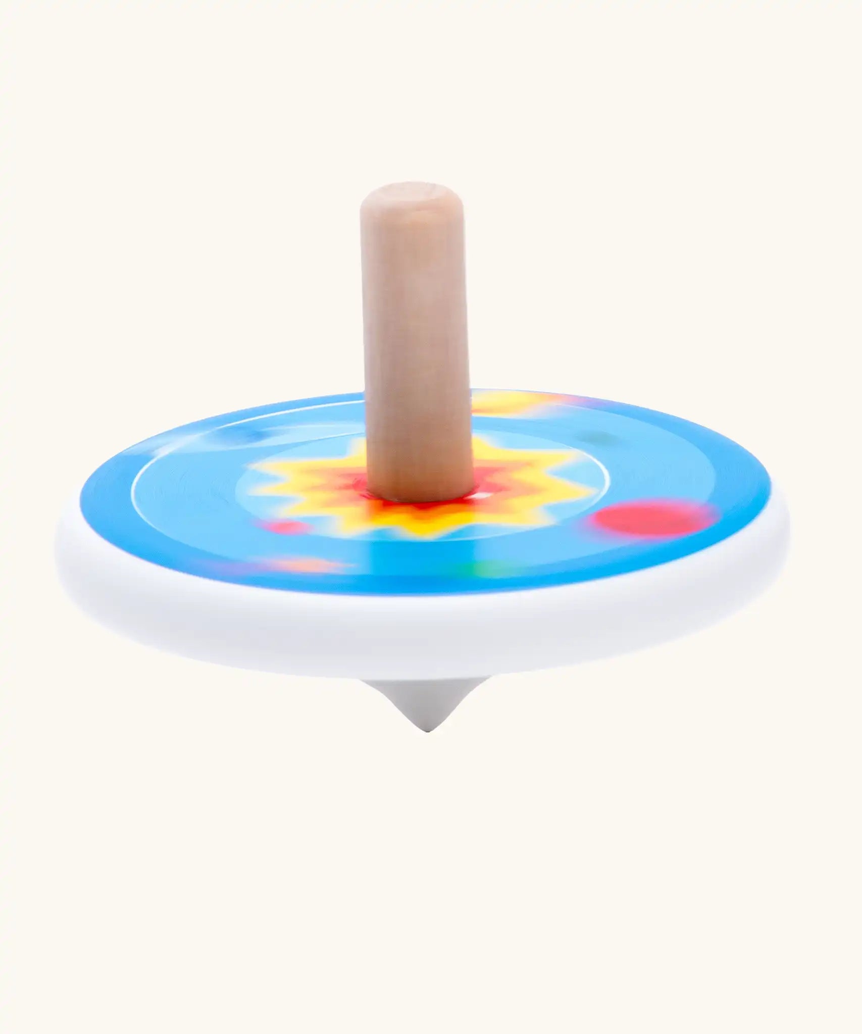 Bajo universe wooden spinning top toy blurred in motion as it spins around.