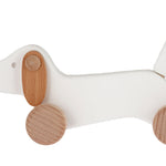 Bajo wooden dachshund puppy toy dog on a white background