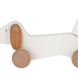 Bajo wooden dachshund puppy toy dog on a white background