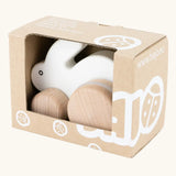 Bajo small white rabbit push along toy in it's cardboard packaging box. 