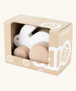 Bajo small white rabbit push along toy in it's cardboard packaging box. 