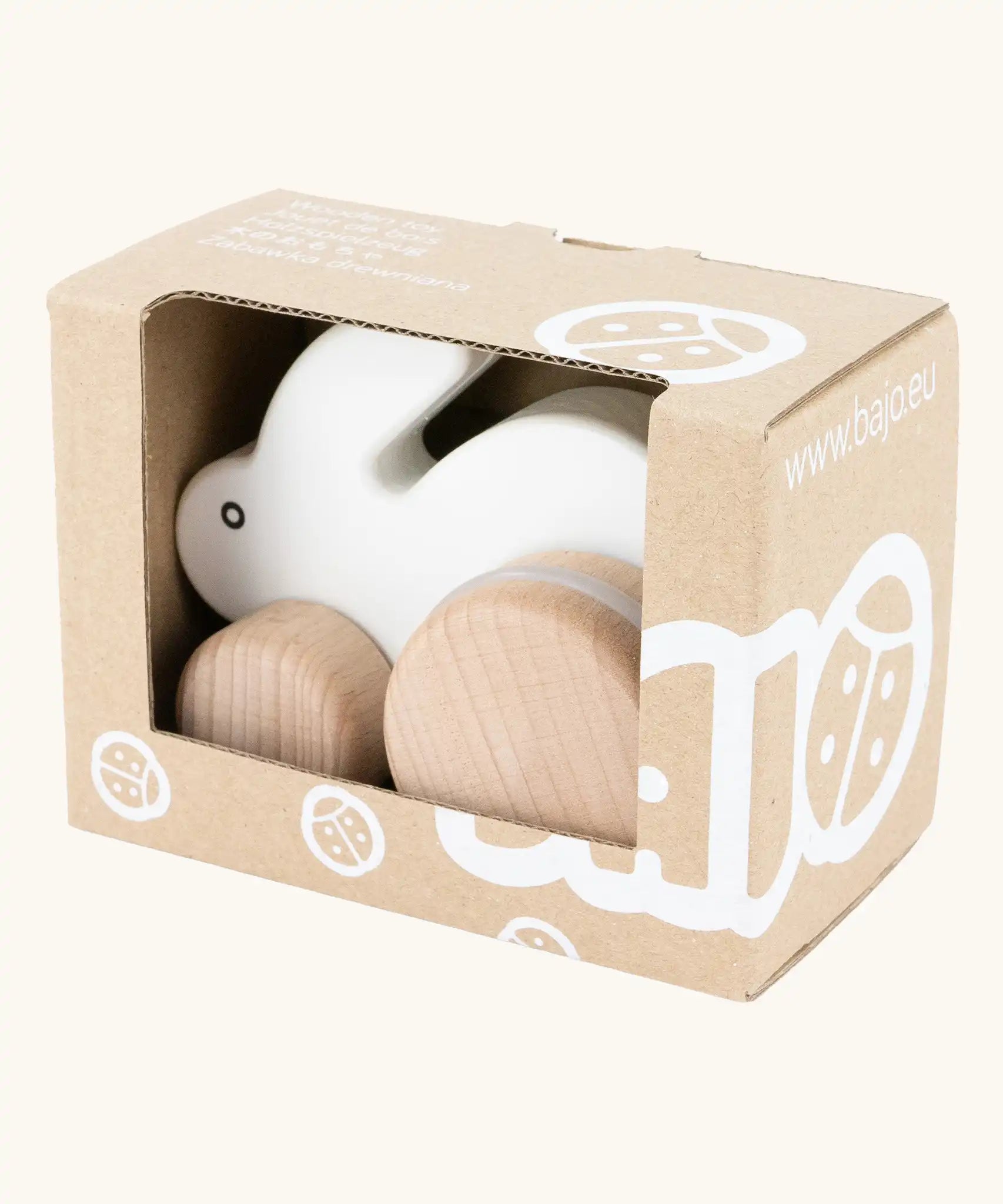 Bajo small white rabbit push along toy in it's cardboard packaging box. 