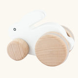 Bajo small white rabbit wooden push along toy. White painted bunny rabbit on natural wooden wheels.