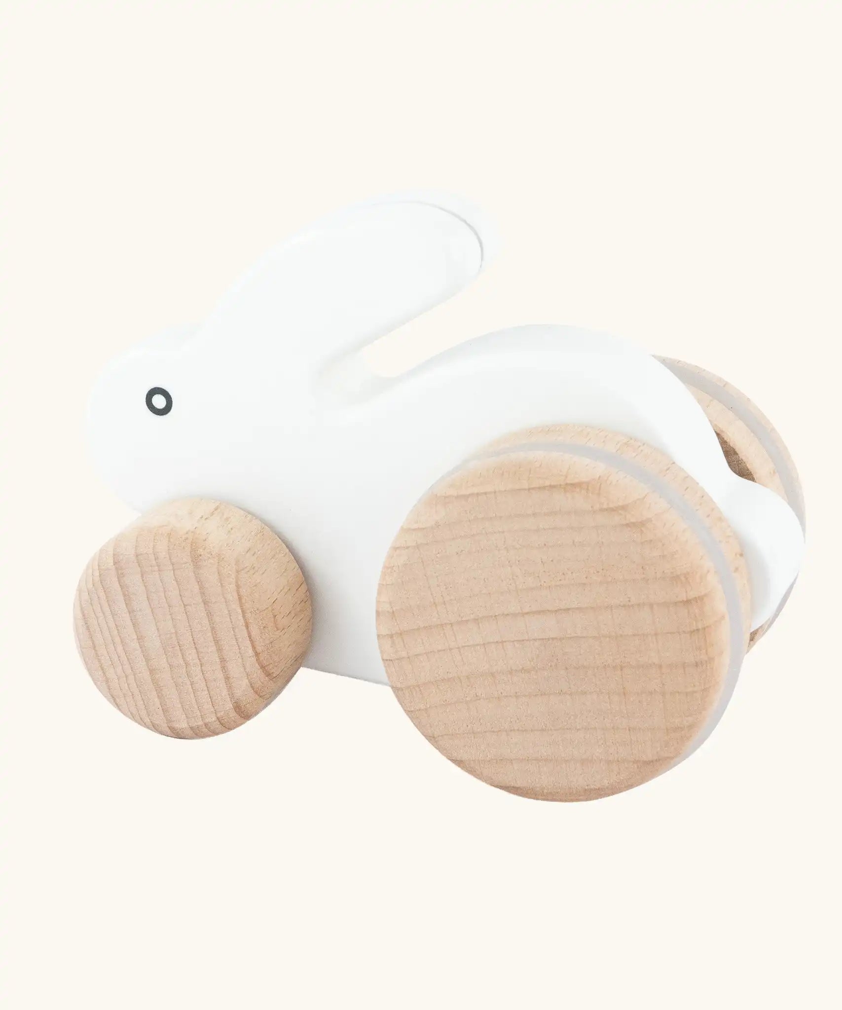 Bajo small white rabbit wooden push along toy. White painted bunny rabbit on natural wooden wheels.