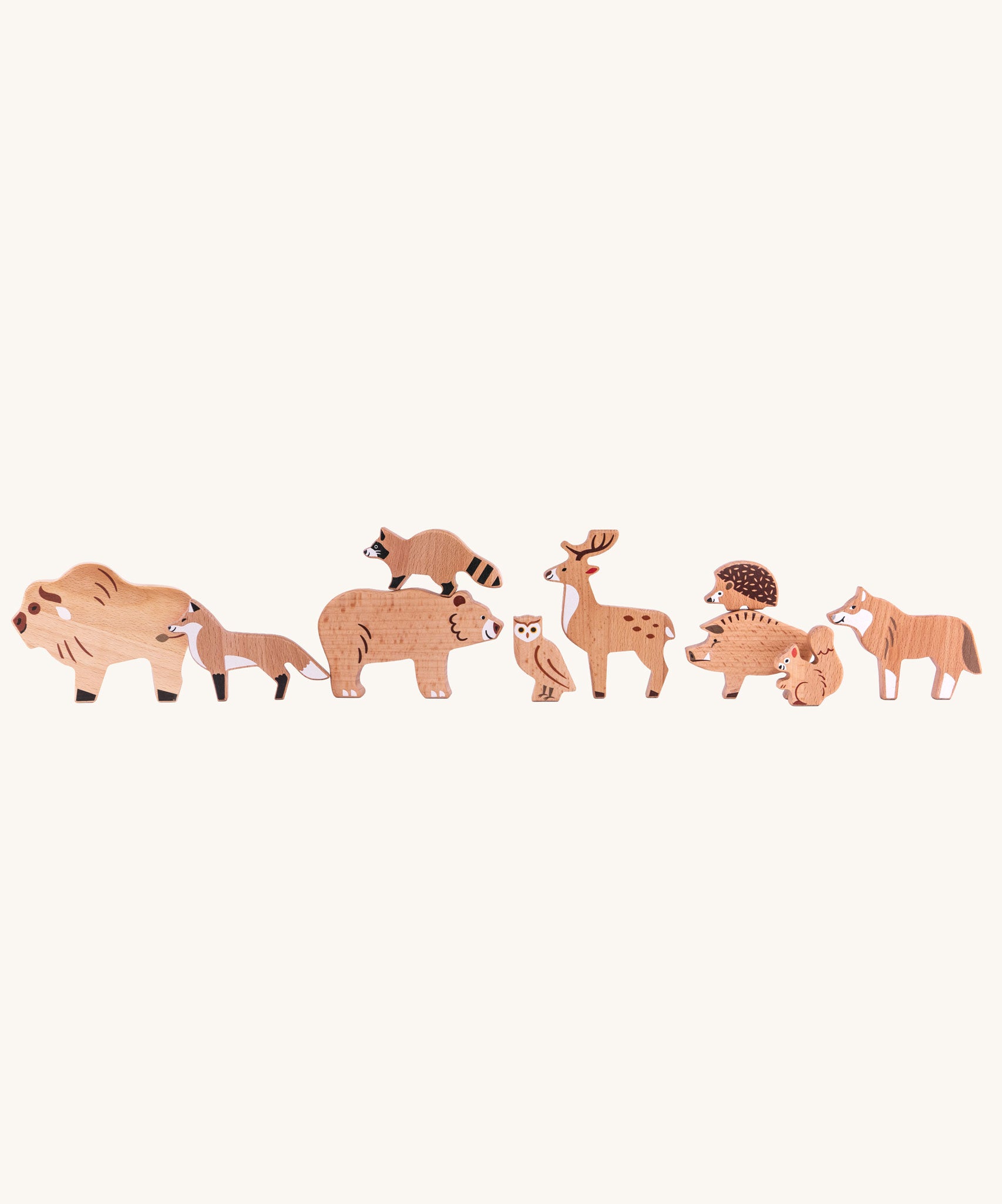 Bajo Wild Animals Forest Set. A set of 10 wooden forest animal figures that include: Fox, Wolf, Bison, Squirrel, Hedgehog Deer, Hog, Owl, Raccoon and Bear. These heirloom quality toys by Bajo are part of a wide range of wooden toys available here at Babipur.
