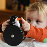 A child playing with the Bajo wobbling penguin push along wooden toy. This toy penguin has large black wheels. These heirloom quality toys by Bajo are part of a wide range of wooden toys available here at Babipur. 