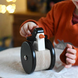 A child playing with the Bajo wobbling penguin push along wooden toy. This toy penguin has large black wheels. These heirloom quality toys by Bajo are part of a wide range of wooden toys available here at Babipur. 