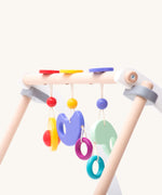 Bajo Wooden Baby Gym with three wooden hanging toys. These heirloom quality toys by Bajo are part of a wide range of wooden toys available here at Babipur. 