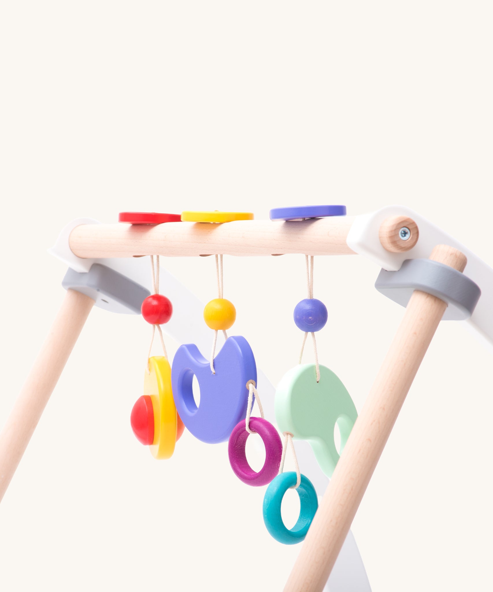 Bajo Wooden Baby Gym with three wooden hanging toys. These heirloom quality toys by Bajo are part of a wide range of wooden toys available here at Babipur. 