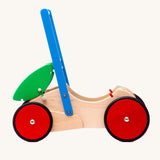 Bajo wooden Baby Walker. A natural wooden walker with red and blue details and red wheels. These heirloom quality toys by Bajo are part of a wide range of wooden toys available here at Babipur. 