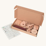 The pieces included in the Bajo DIY Tractor build your own kit in their box. These heirloom quality toys by Bajo are part of a wide range of wooden toys available here at Babipur. 