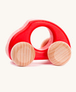 Bajo handmade wooden beetle style car in red and available at Babipur features unpainted wheels, can be pushed or pulled along.