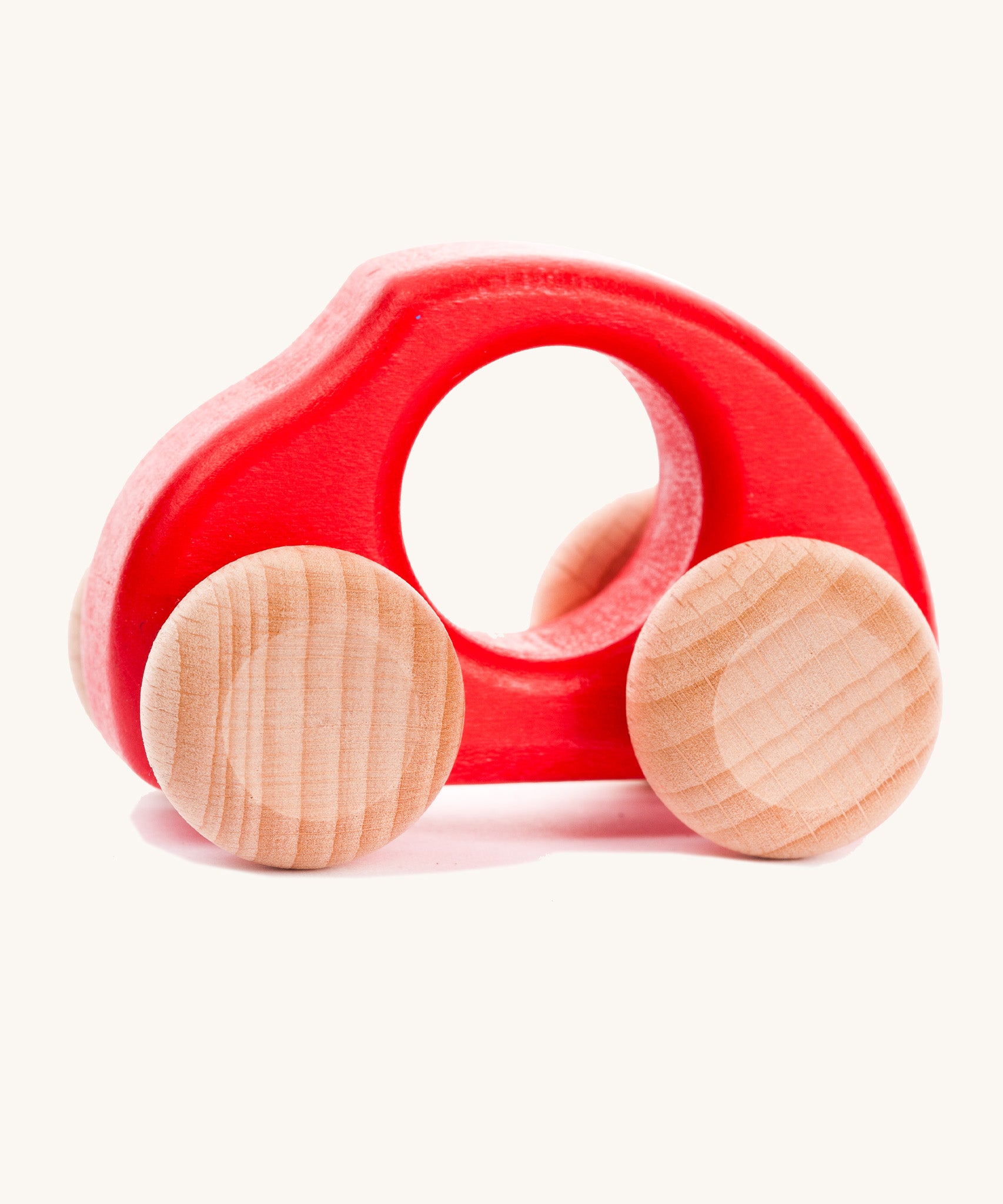 Bajo handmade wooden beetle style car in red and available at Babipur features unpainted wheels, can be pushed or pulled along.