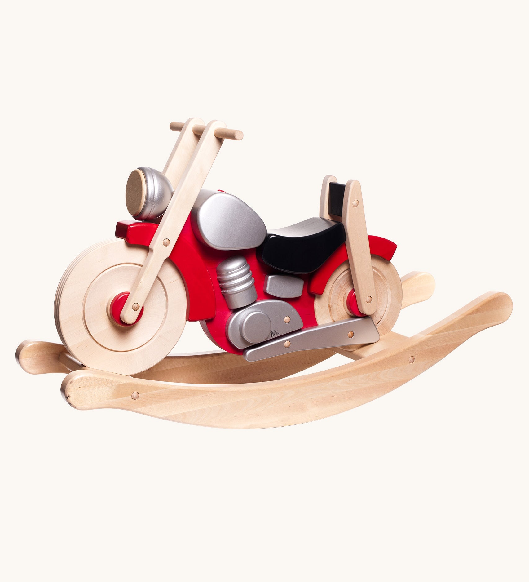 Bajo wooden rocking motorcycle toy with a natural light wood finish, red body panels, a black seat, and silver engine details.