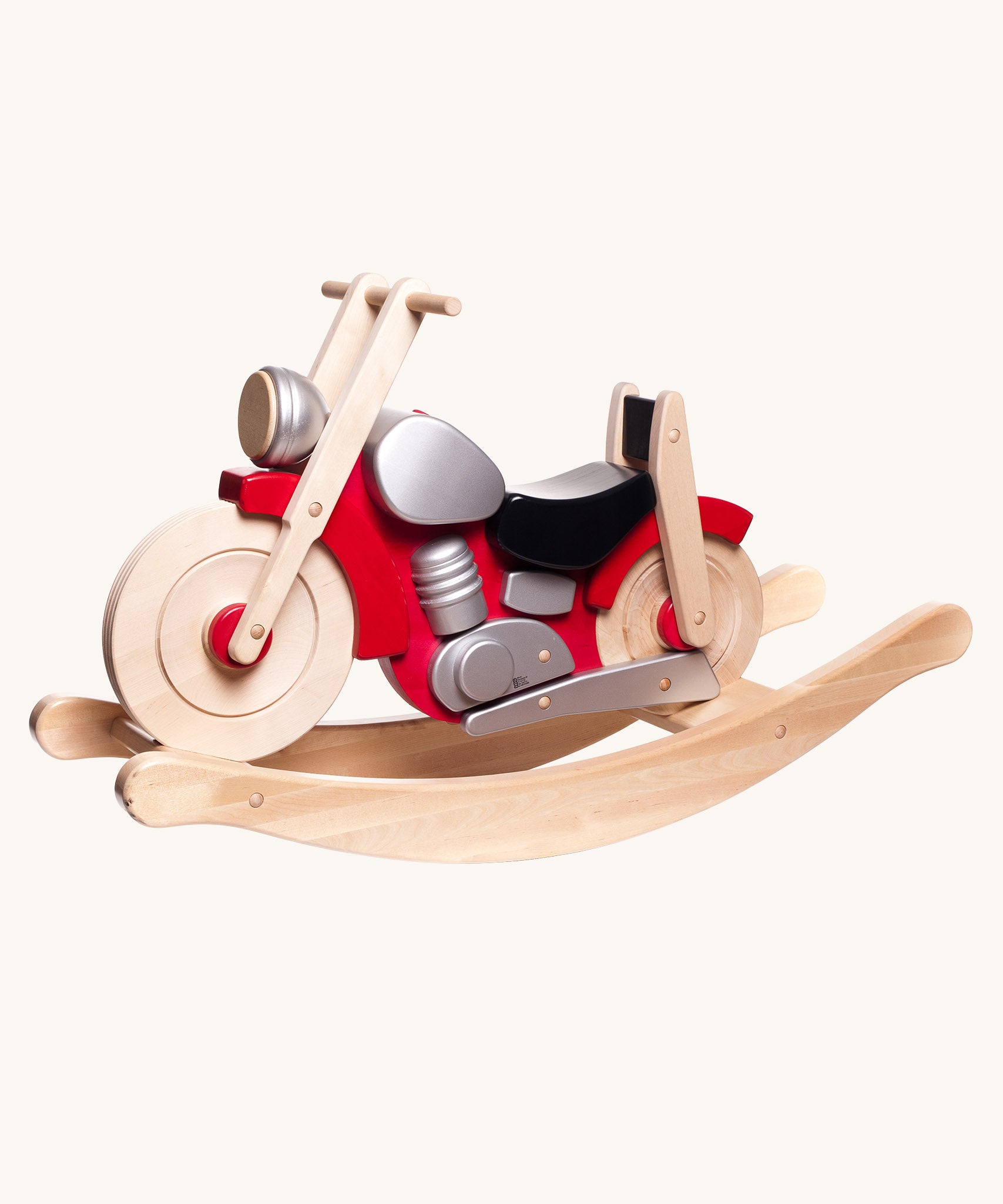 Bajo wooden rocking motorcycle toy with a natural light wood finish, red body panels, a black seat, and silver engine details.